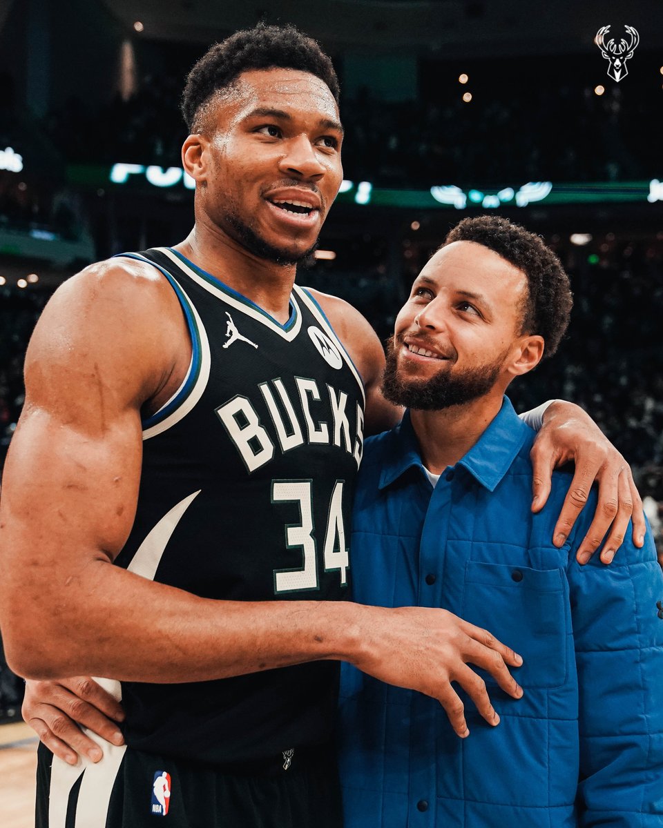 A photo of Giannis Antetokounmpo and Stephen Curry hugging postgame.