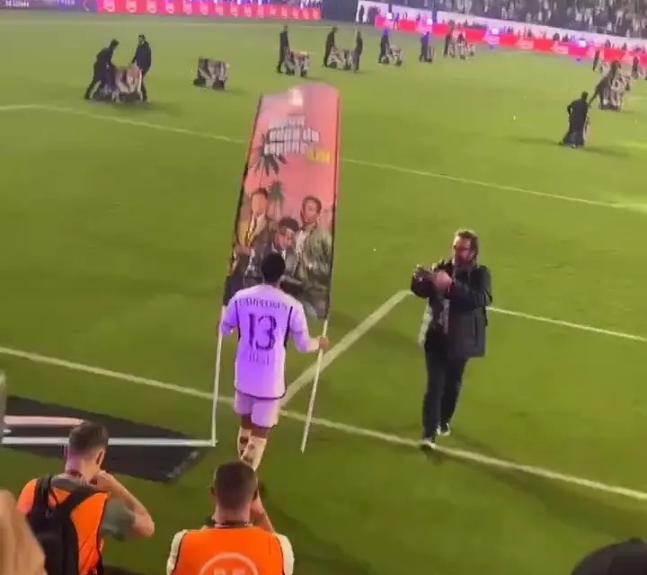 He walked off with the banner and began parading it around the pitch