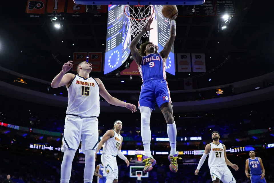 Philadelphia 76ers' Kelly Oubre Jr. (9) goes up for a shot against Denver Nuggets' Nikola Jokic (15) during the first half of an NBA basketball game, Tuesday, Jan. 16, 2024, in Philadelphia. (AP Photo/Matt Slocum)