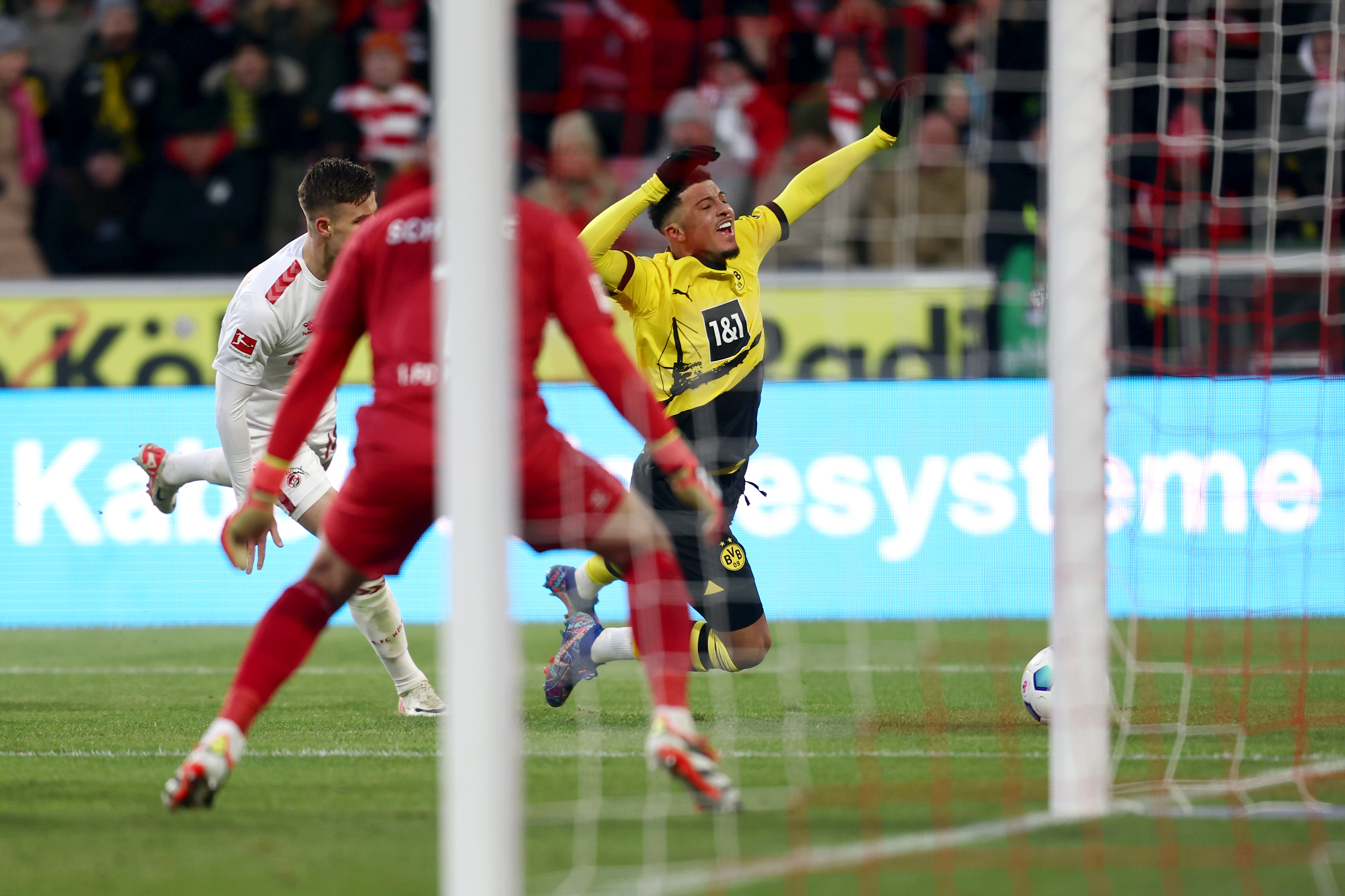 Jadon Sancho won the penalty after being fouled against Koln