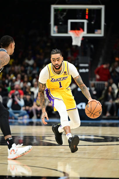 Angelo Russell of the Los Angeles Lakers handles the ball during the game against the Atlanta Hawks on January 30, 2024 at State Farm Arena in...