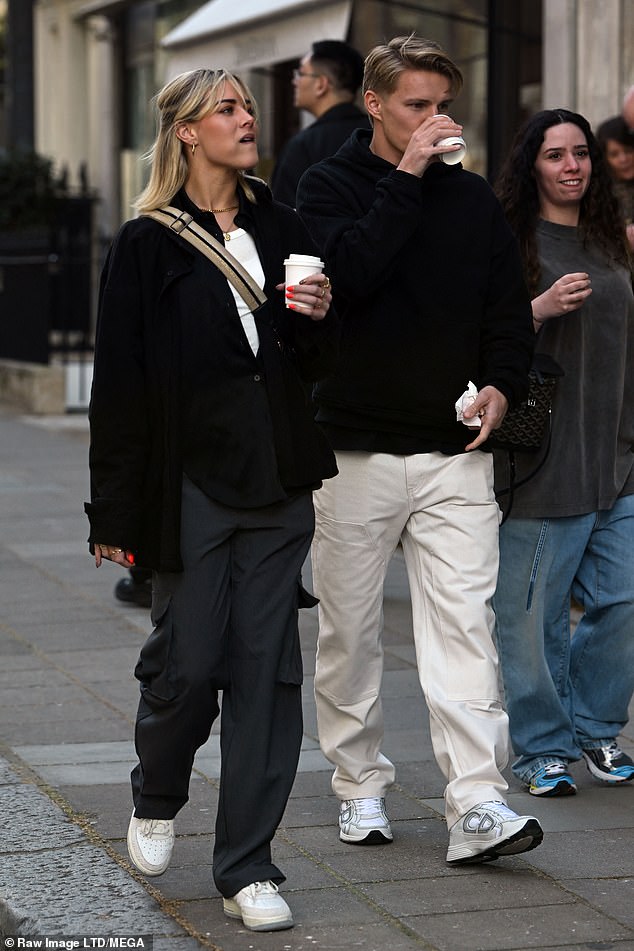 Out and about: They looked happy and relaxed in each other's company as they sipped on coffees