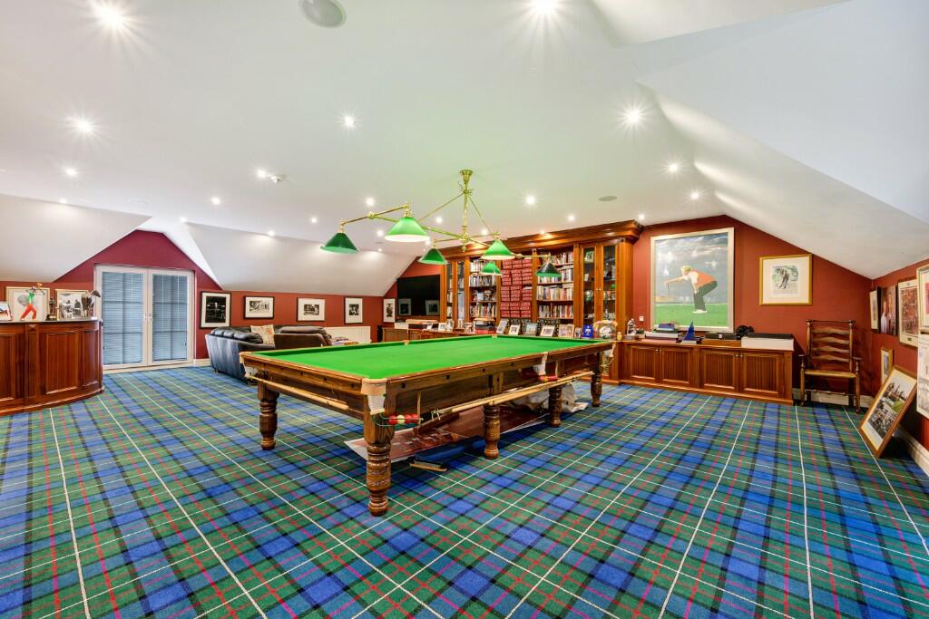 It comes with a huge games room with a snooker table