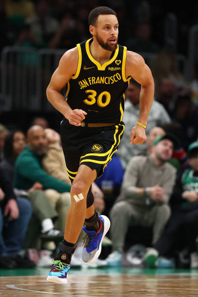 Stephen Curry of the Golden State Warriors runs downcourt against the Boston Celtics during the second quarter at TD Garden on March 03, 2024 in...