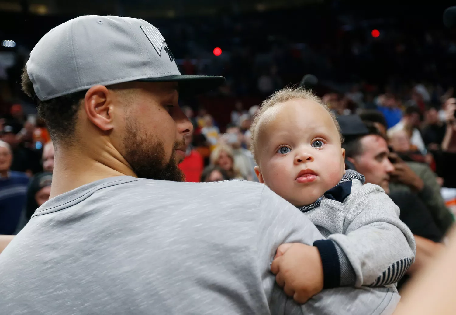 Stephen Curry #30 of the Golden State Warriors holds his son Canon W. Jack Curry after defeating the Portland Trail Blazers 119-117 during overtime in game four of the NBA Western Conference Finals to advance to the 2019 NBA Finals at Moda Center on May 20, 2019 in Portland, Oregon.