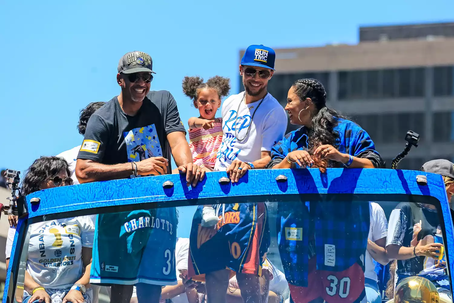 Stephen Curry #30 of the Golden State Warriors poses for a photo with his family, Dell Curry, Ayesha Curry and Ryan Curry from his bus during the Victory Parade on June 12, 2018 in Oakland, California. The Golden State Warriors beat the Cleveland Cavaliers 4-0 to win the 2018 NBA Finals