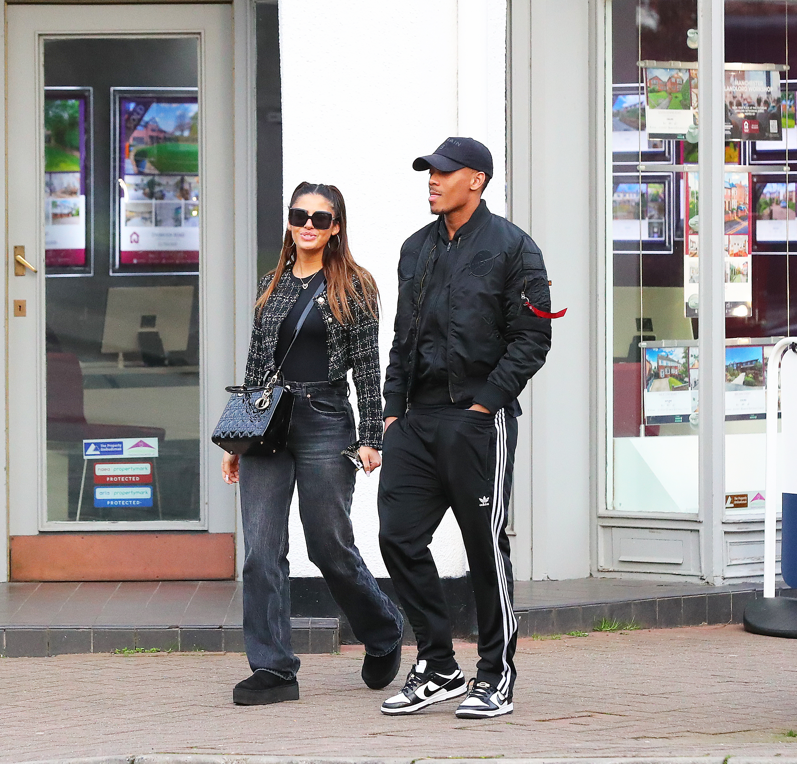 Martial cut a relaxed figure as he walked hand in hand