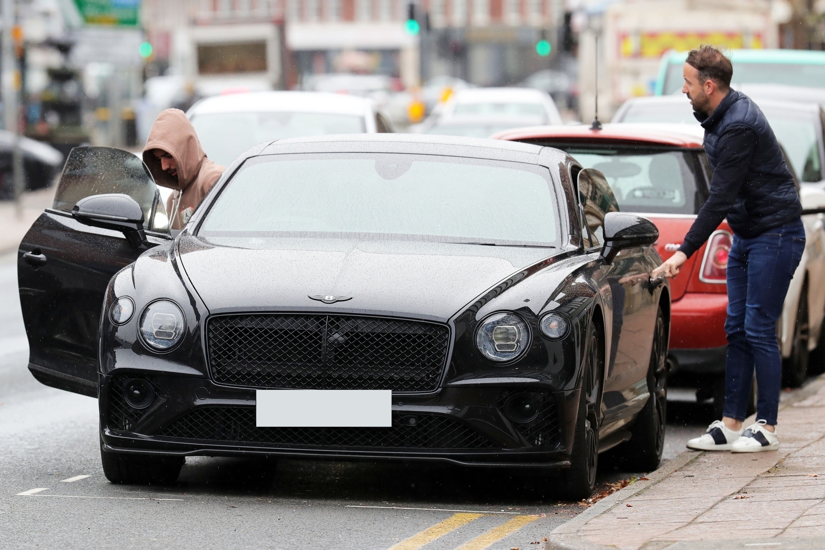 They then climved into a black motor before hitting the road