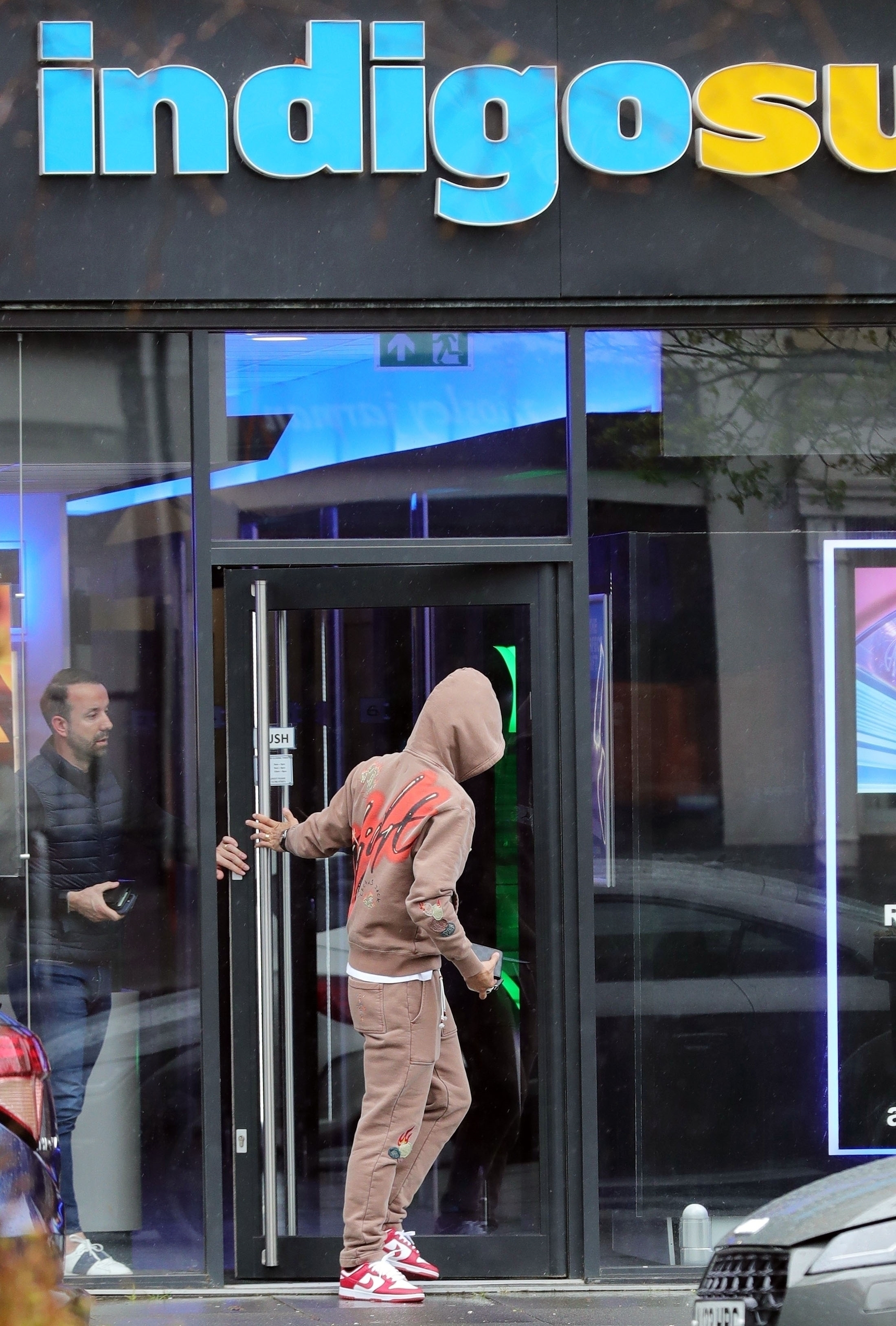The Man Utd star pulled up his hood as he left the establishment in Wilmslow