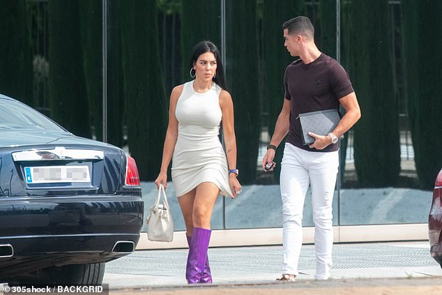 Hot stuff: Georgina looked sensational in her skintight outfit, which showcased her legs and highlighted her incredible figure