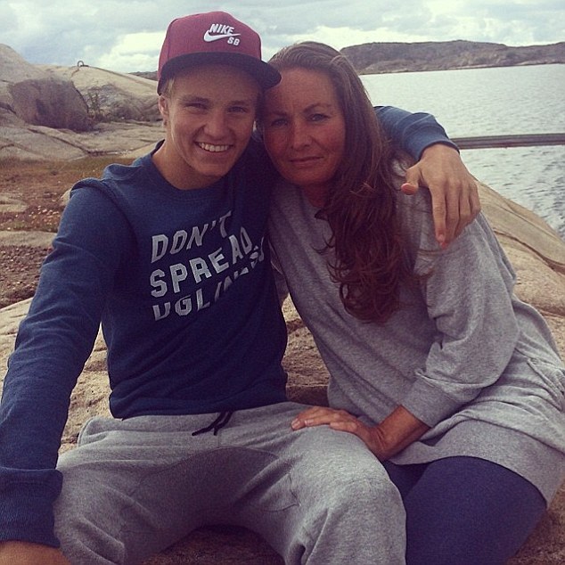 Family man: The young footballer, pictured in Sweden with his mother, was brought up in a strong Christian family