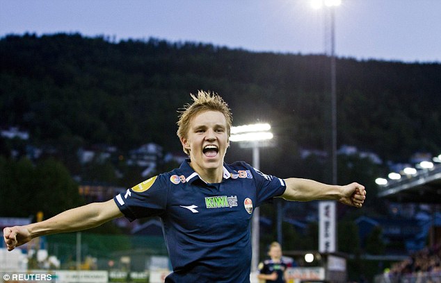 Odegaard celebrates scoring for Stromsgodest in Norway in May 2014 at the age of just 15