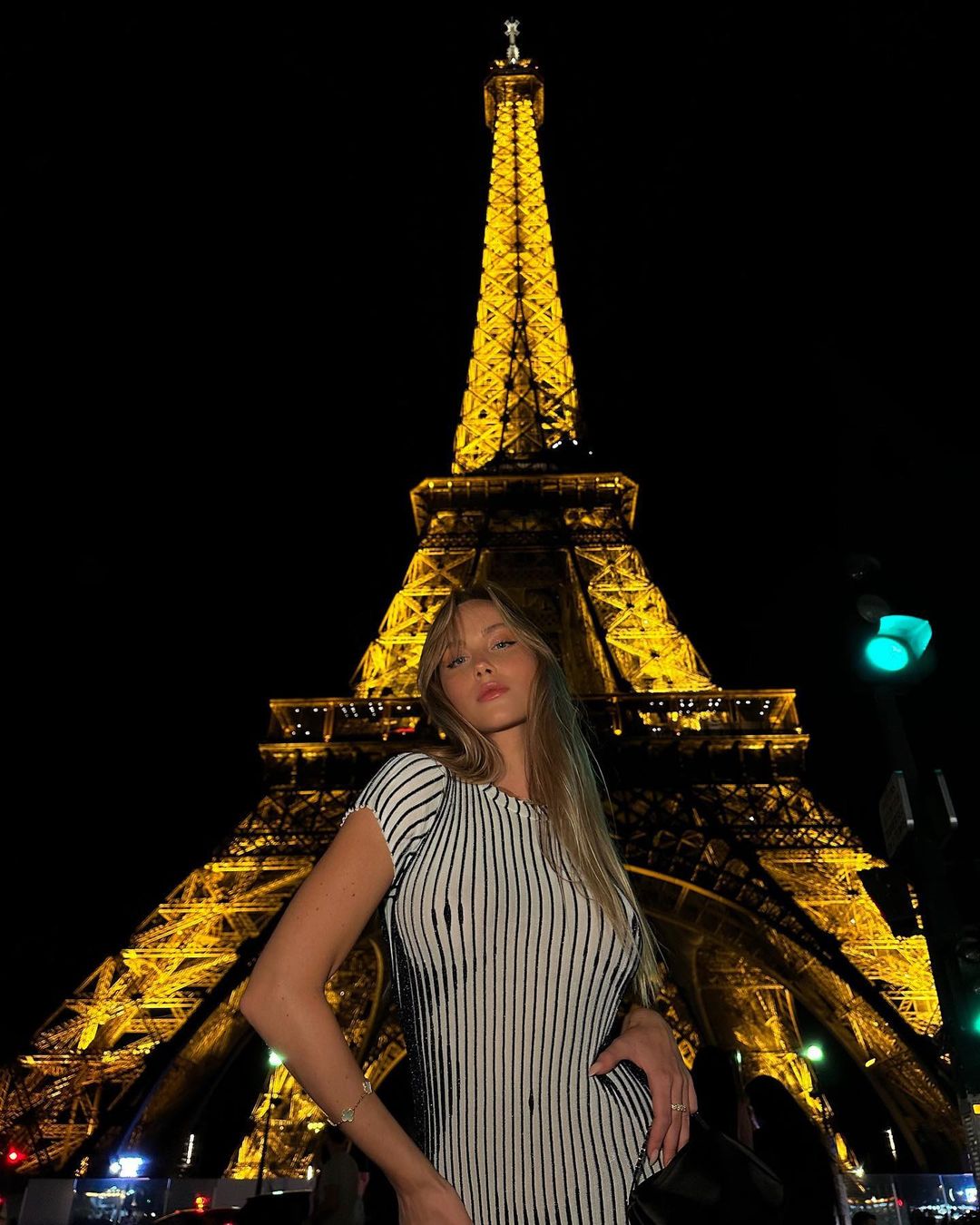 Boston Celtics center Kristaps Porzingis' girlfriend, Laura Vizla, posed for photos in a optical illusion dress in front of the Eiffel Tower