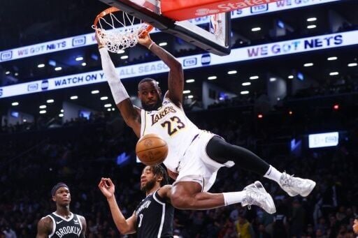 LeBron James of the Los Angeles Lakers slam dunks the ball during his  40-point performance in an NBA victory at Brooklyn | National News |  indianagazette.com