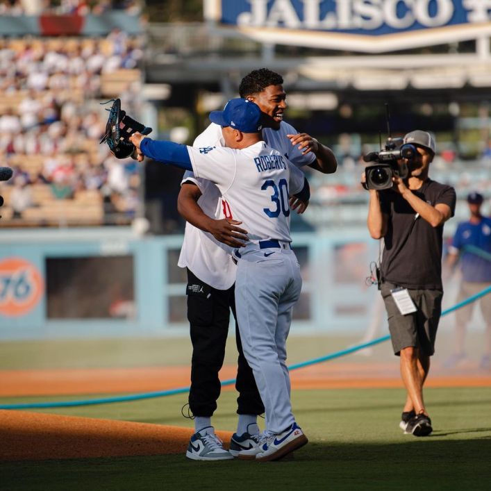 Rui Hachimura at a baseball game with the LA Dodgers, surrounded by family joy to welcome Shohei Ohtani