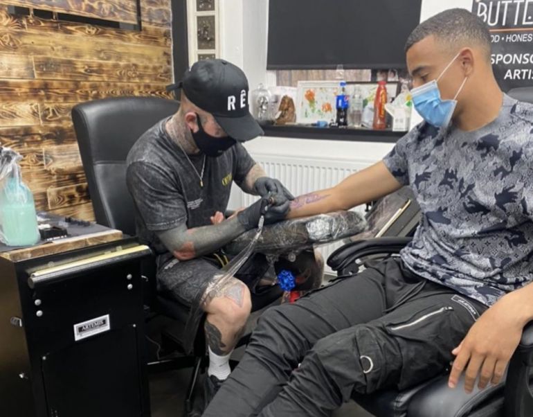 Photos: Greenwood shows off new tattoo after session with leading artist