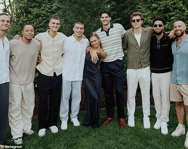 Payton's parents and star basketball players, Anthony Mathis, (shown right second to left) and Brooks DeBisschop, (shown on the right of Emma) were also in attendance