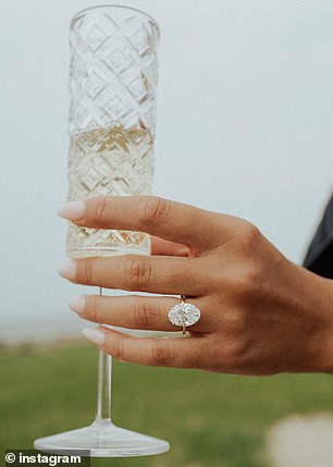 The YouTuber shared a close-up photo of her oval-cut diamond ring, which sat on a gold band