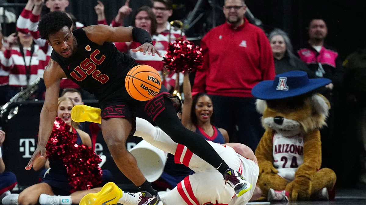 Southern California Trojans guard Bronny James (6) and Arizona Wildcats guard Pelle Larsson (3) battle for the ball in the first half at T-Mobile Arena.