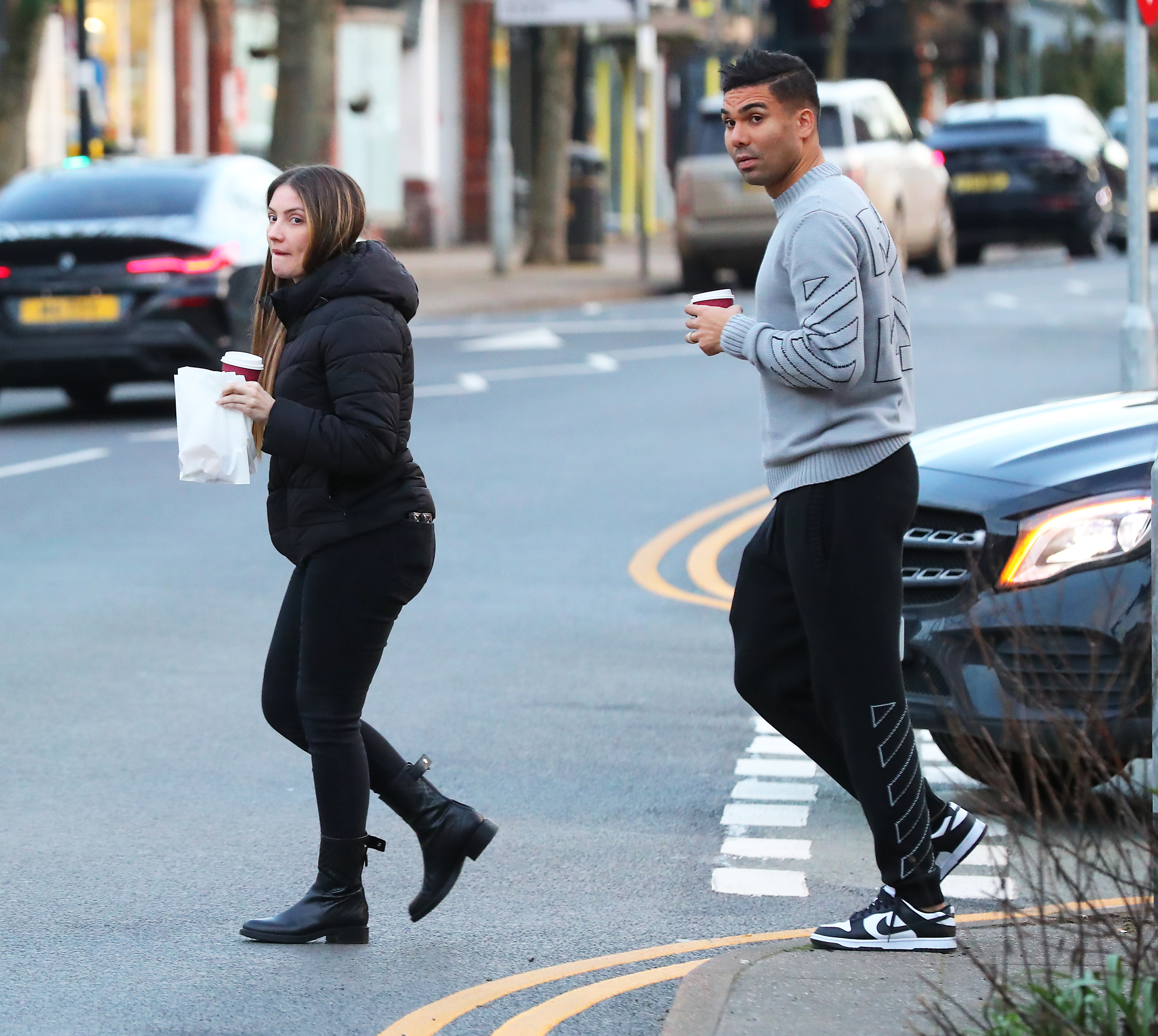 The pair dashed across the road to their luxury car