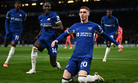 Cole Palmer slides on his knees after scoring the second of his four goals against Everton