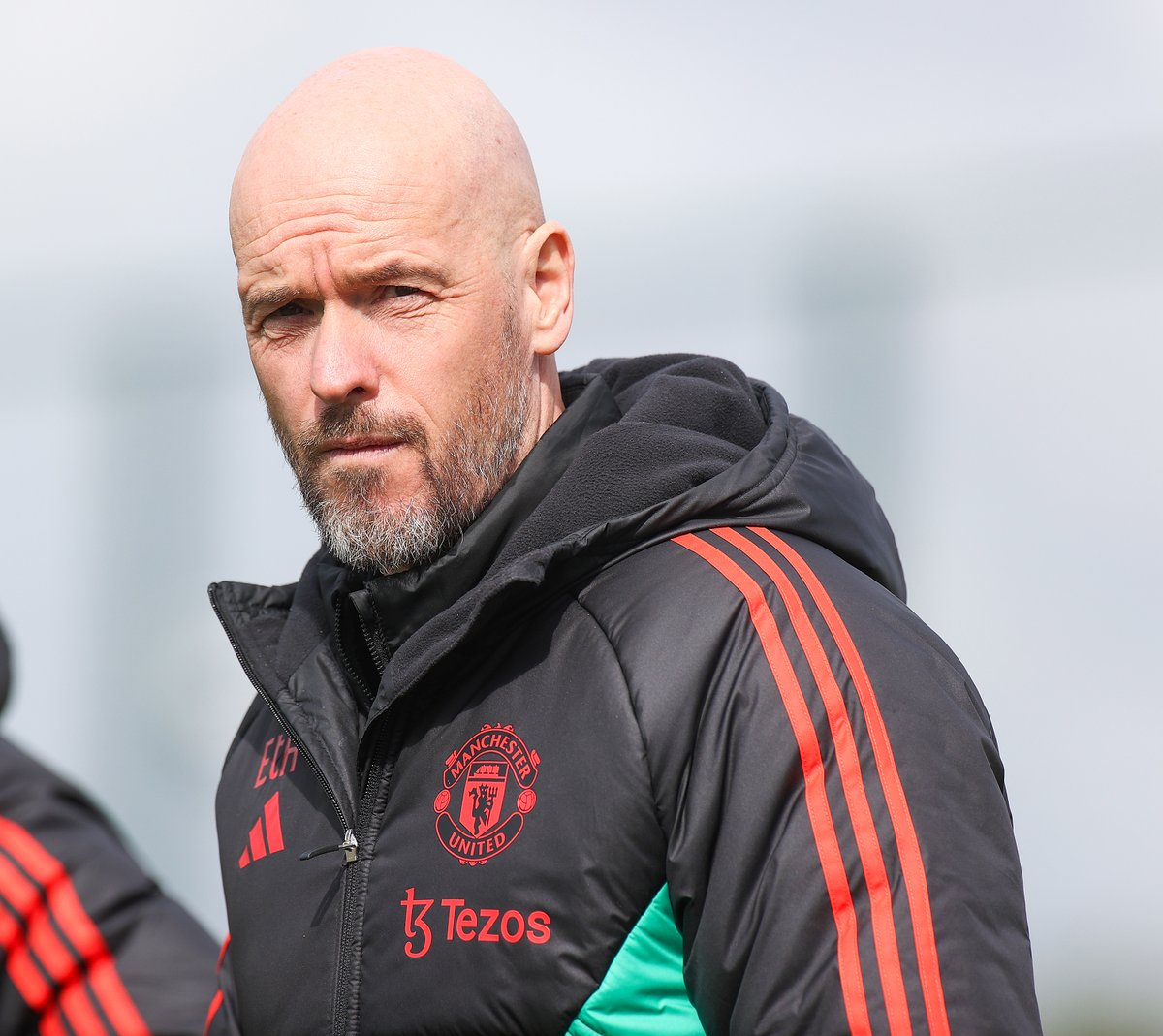 Erik ten Hag walks out to training.