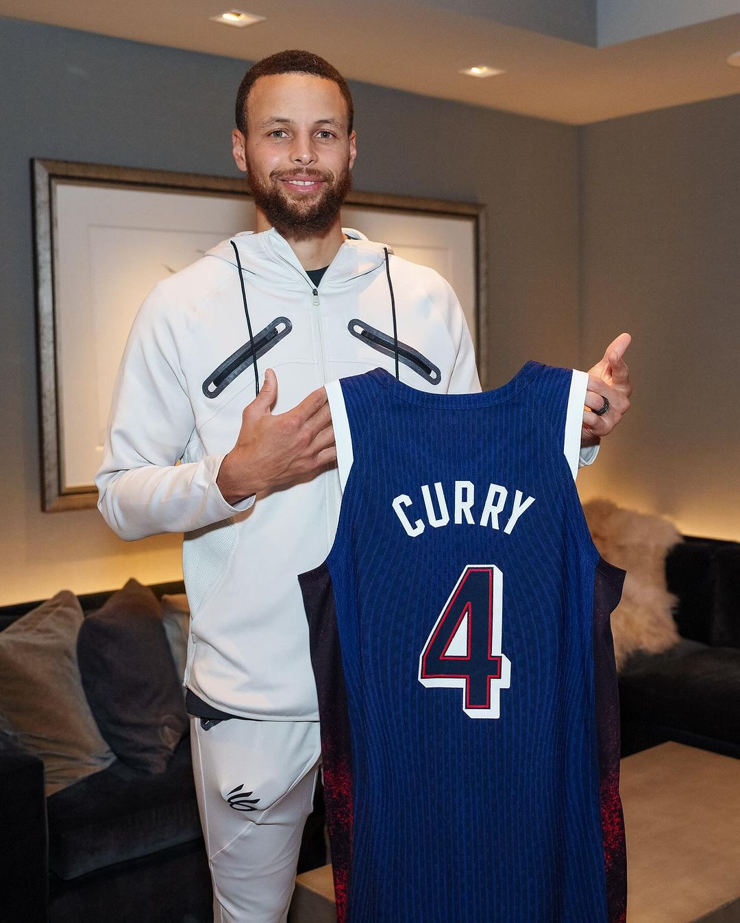 May be an image of 1 person, playing basketball, basketball jersey and text that says "CURRY 4"