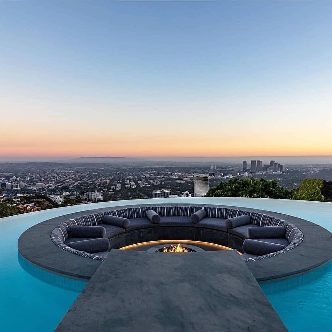  The infinity pool features a floating lounge area with breathtaking views of LA