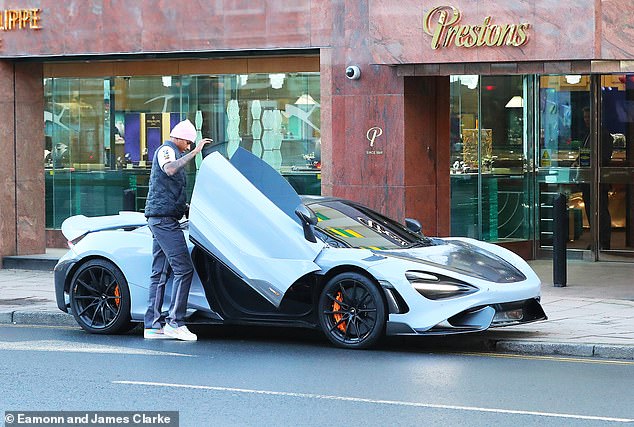 Marcus Rashford is pictured getting into his £280K McLaren after indulging  in some retail therapy at his 'favourite jewellers'... as he misses  Manchester United's Champions League game due to one-match ban |