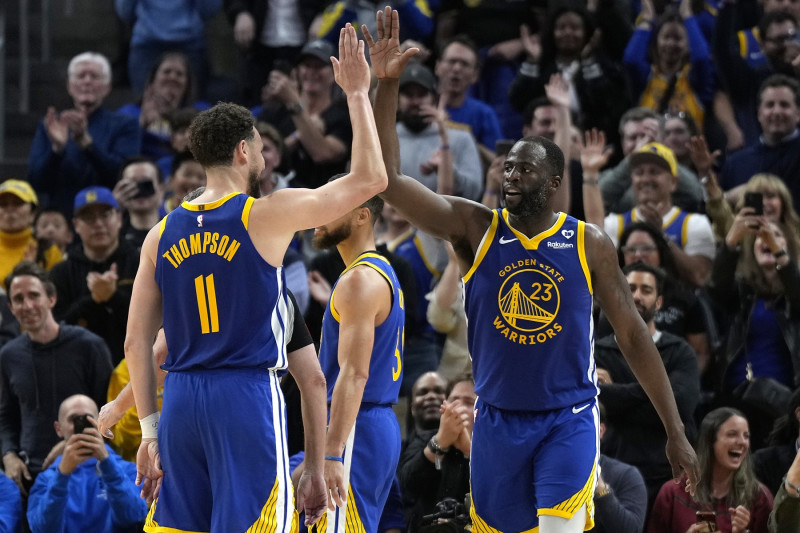 SAN FRANCISCO, CALIFORNIA - APRIL 02: Draymond Green #23 of the Golden State Warriors celebrates with Klay Thompson #11 after scoring against the Dallas Mavericks late in the second half at Chase Center on April 02, 2024 in San Francisco, California. NOTE TO USER: User expressly acknowledges and agrees that, by downloading and or using this photograph, User is consenting to the terms and conditions of the Getty Images License Agreement. (Photo by Thearon W. Henderson/Getty Images)