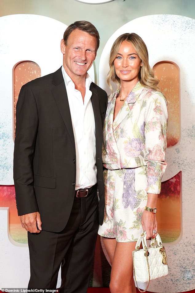 Teddy Sheringham looked suave in a black suit as he posed on the red carpet alongside his wife Kristina Andriotis