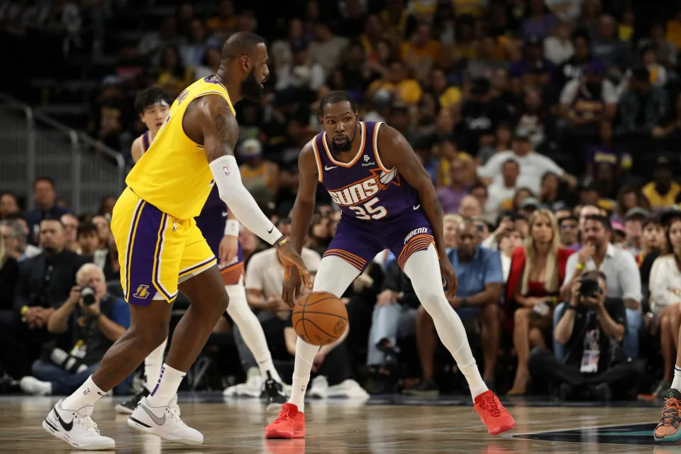 Oct 19, 2023; Palm Desert, California, USA;  Phoenix Suns forward Kevin Durant (35) defends Los Angeles Lakers forward LeBron James (23) during the first quarter at Acrisure Arena. Mandatory Credit: Kiyoshi Mio-USA TODAY Sports