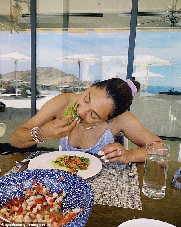 Time for some guilt free food: She enjoyed seafood on a bed of lettuce and a glass of water