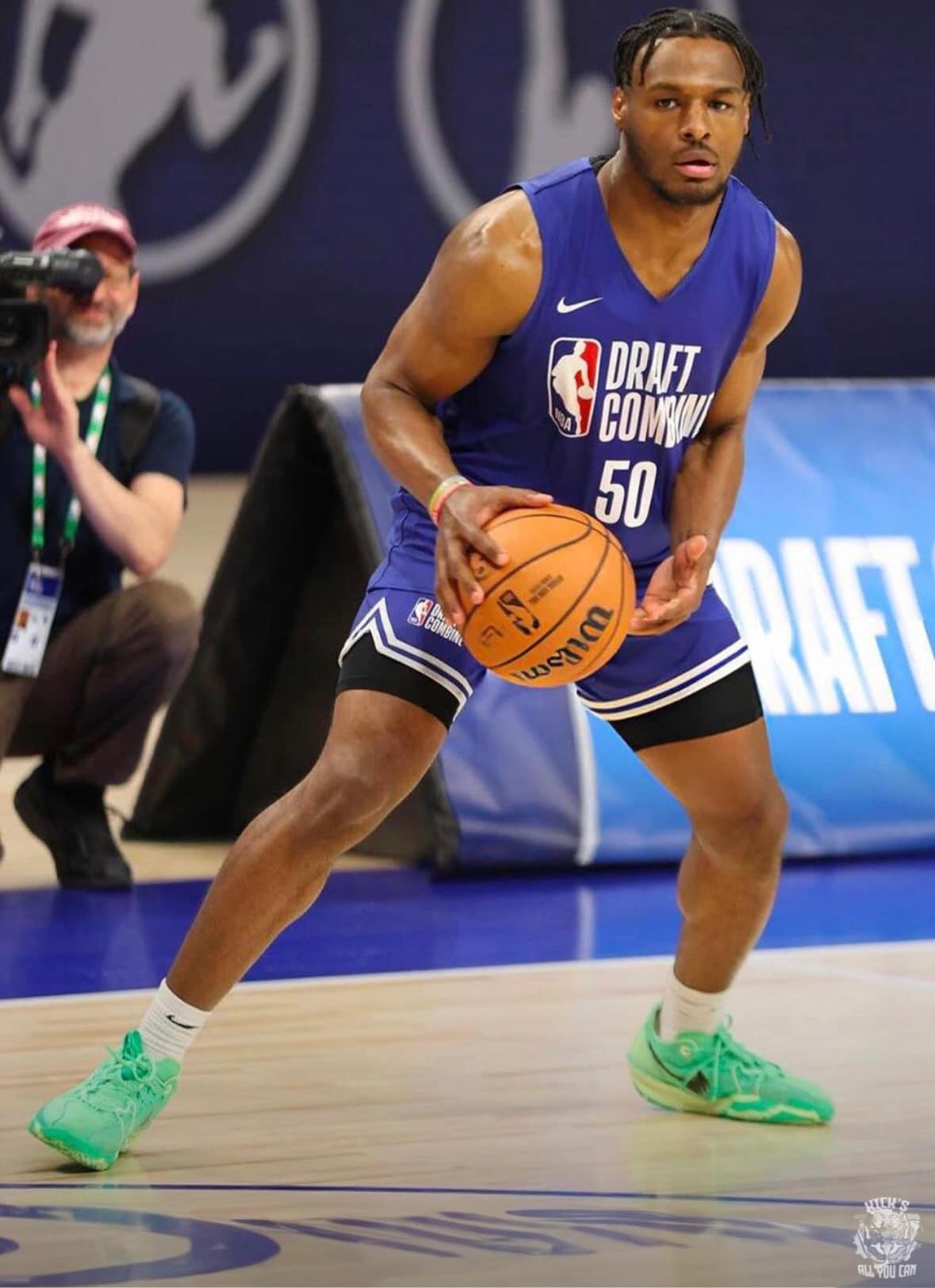 May be an image of 1 person, playing basketball, basketball jersey and text