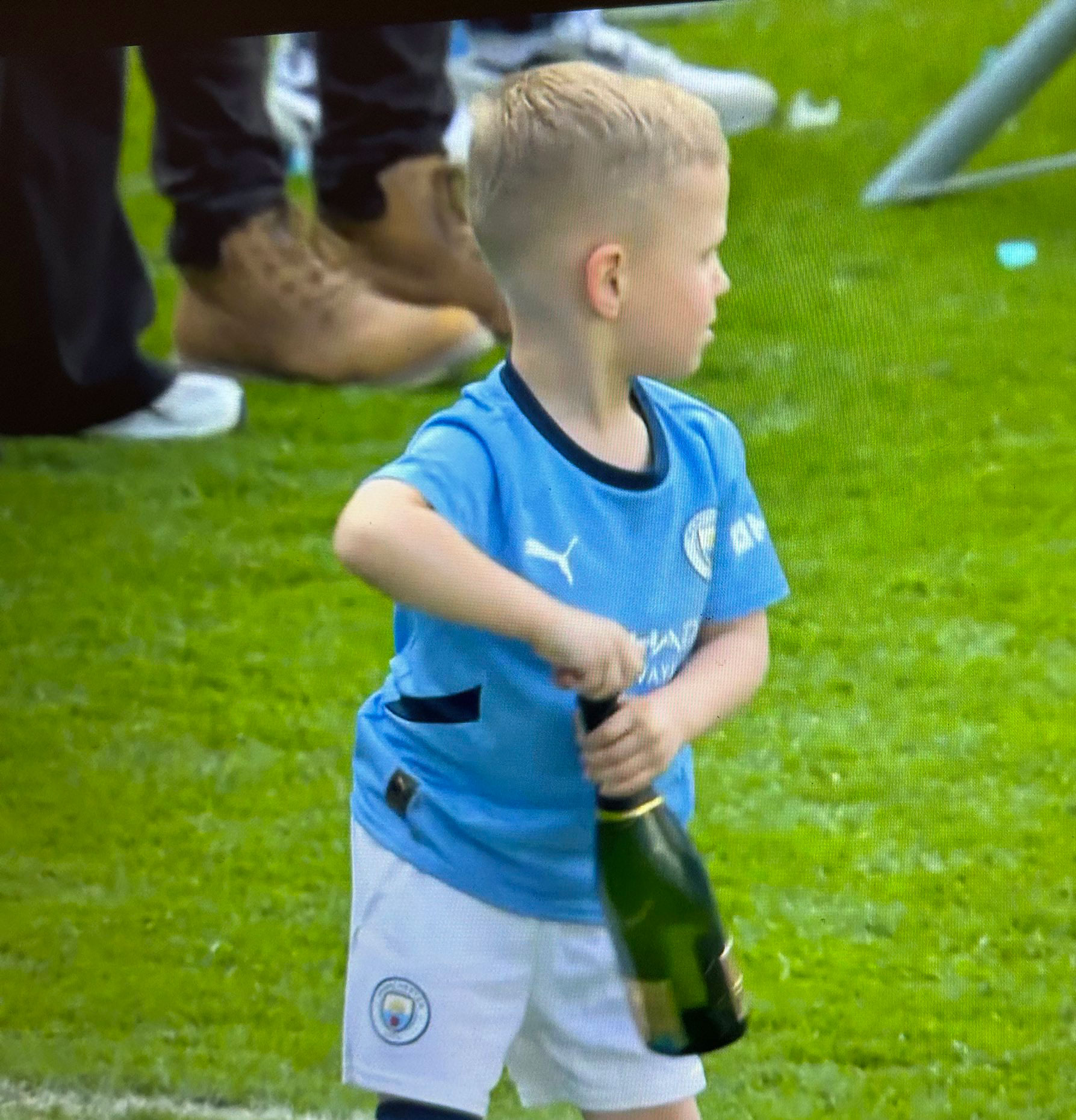 Five-year-old Ronnie struggled with the cork before abandoning the booze