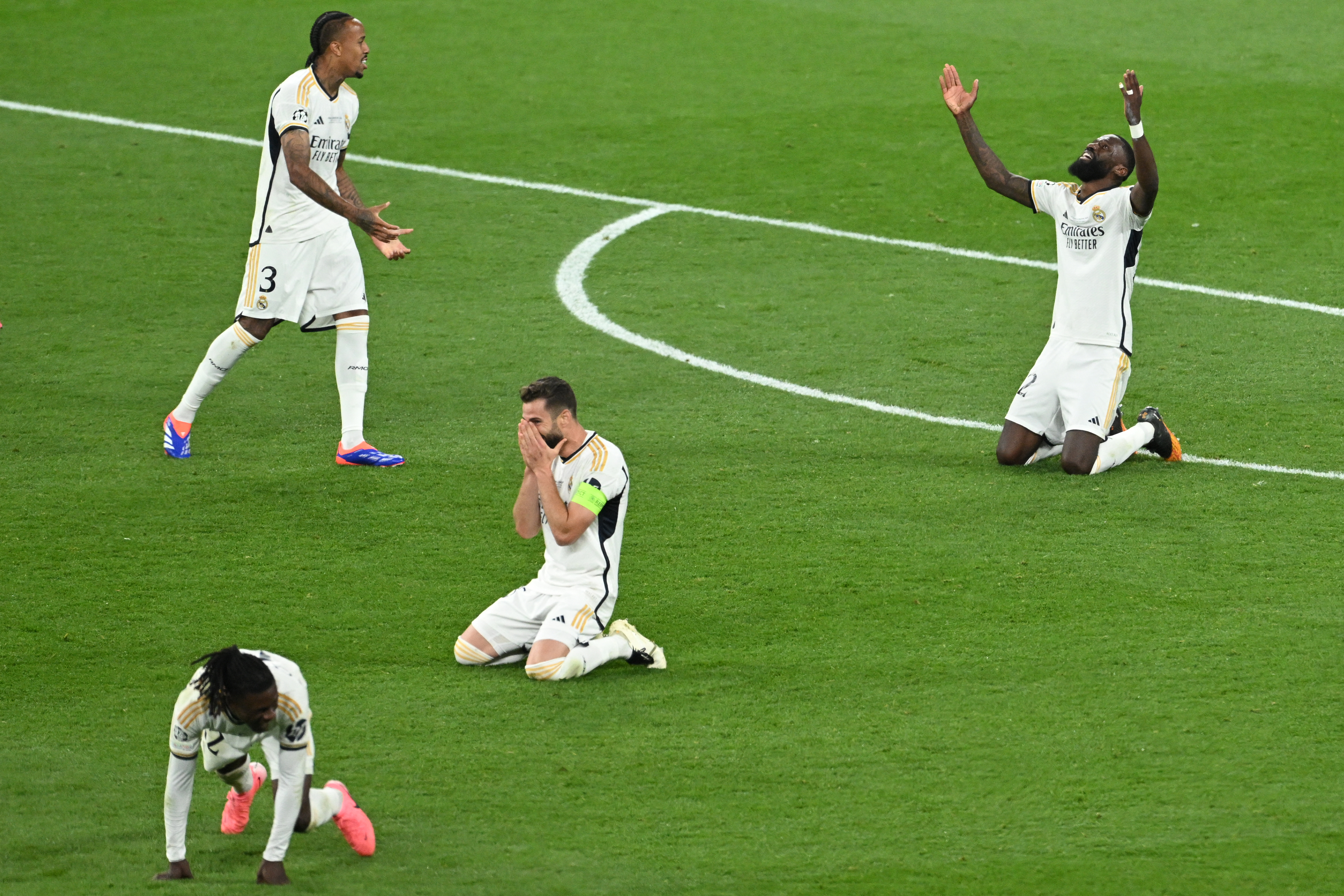 Real Madrid players celebrate at the final whistle