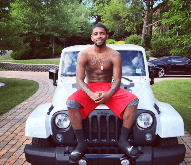 Irving poses with his Jeep Wrangler