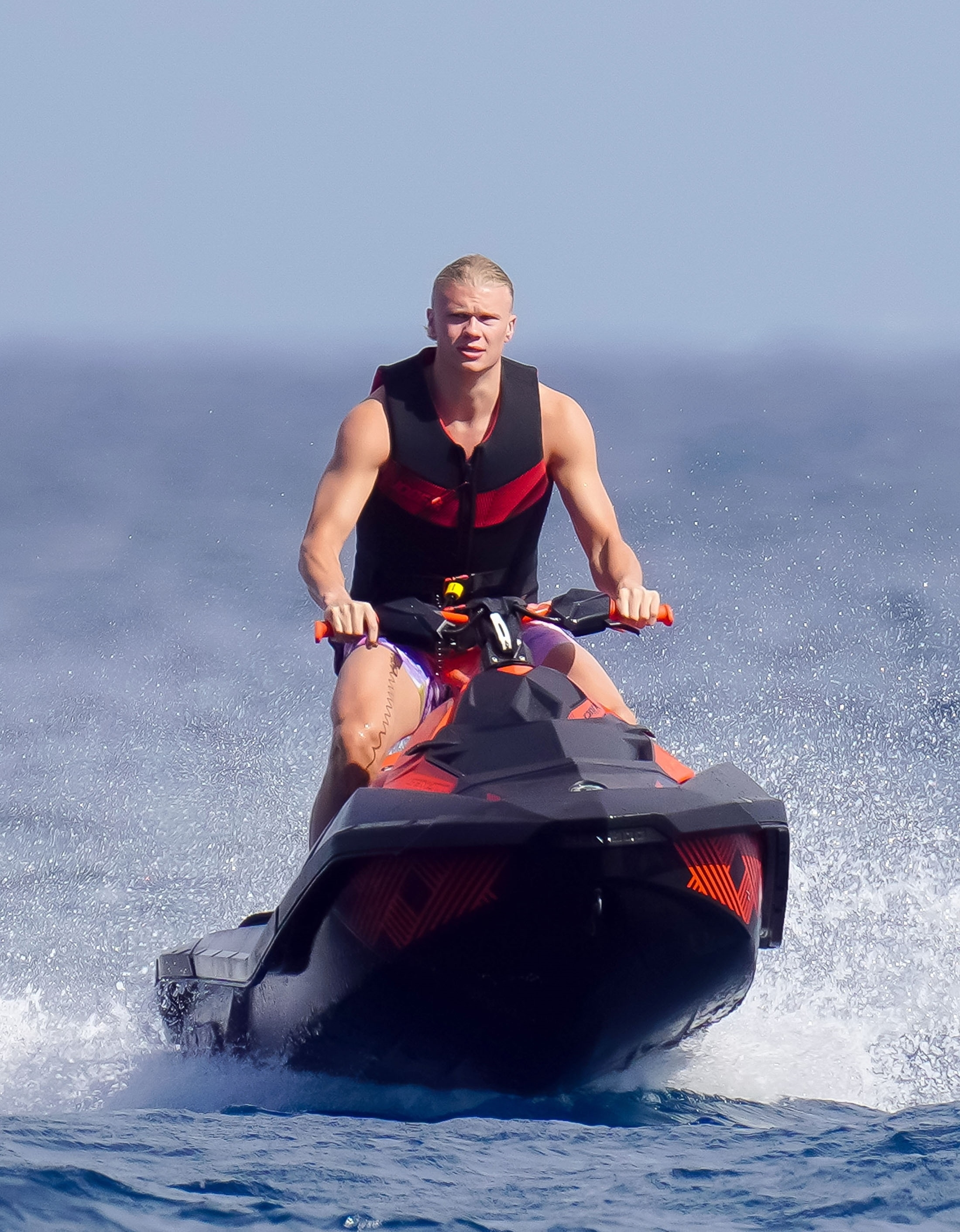 Erling was pictured going on a ride on a jet ski while on his holiday