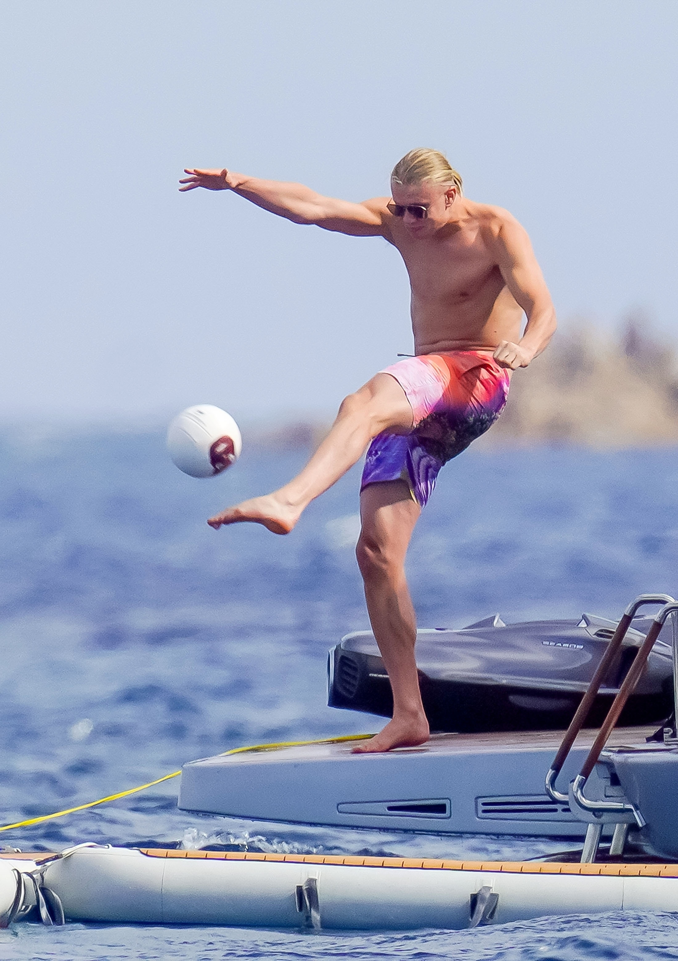 Erling Haaland kicks a ball around after missing the boat on qualifying for the Euros