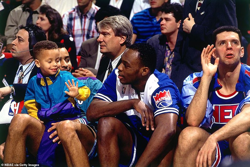 (From left) Dell Curry of the Charlotte Hornets and his son Stephen Curry sit with Mitch Richmond of the Sacramento Kings and Drazen Petrovic of the New Jersey Nets as former NBA player and then-Golden State Warriors coach Don Nelson looks on from behind