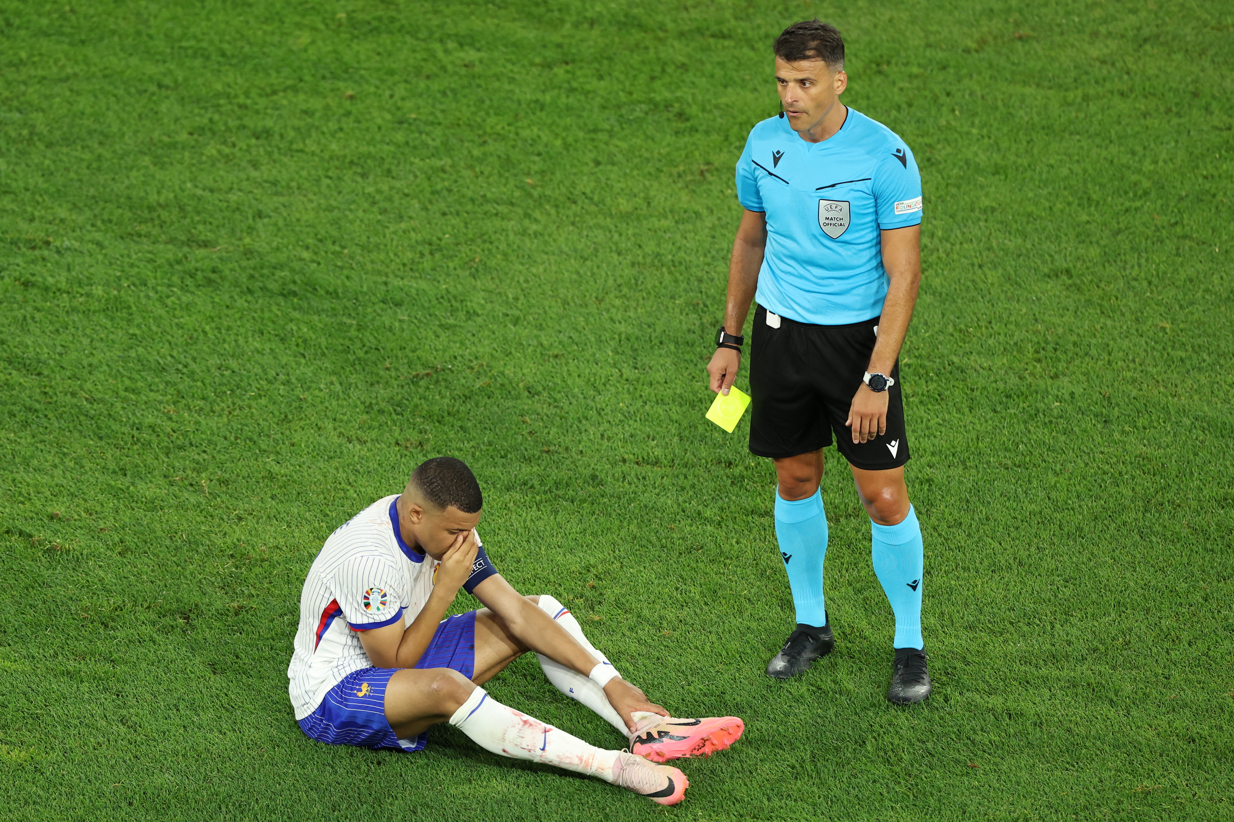 The star plonked himself on the turf after walking on from the sideline