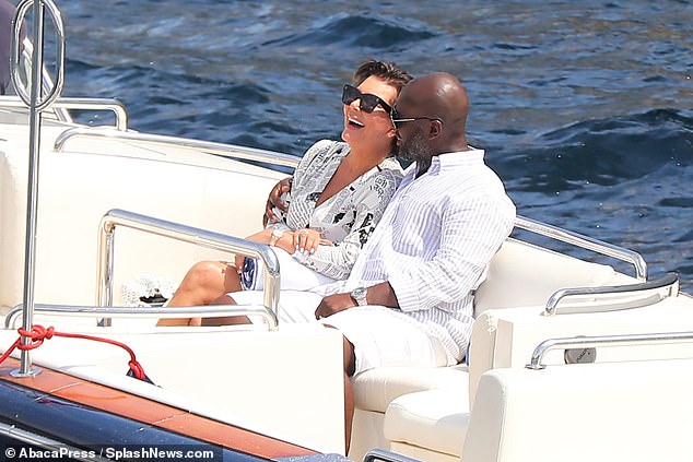 Happy days: Kris Jenner and her beau Corey Gamble put on a very sweet display as they cosied up on a boat to be taken to their yacht in Monaco on Friday