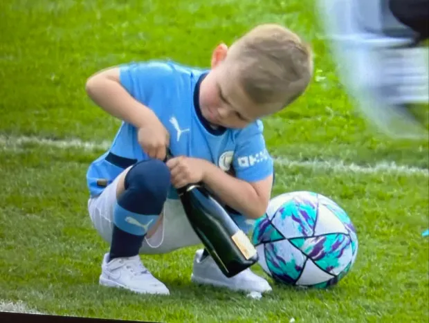 Phil Foden's son Ronnie adorably tried to open a bottle of champagne after Man City's title win