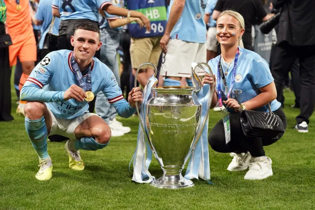 She often appears on the pitch after City win trophies