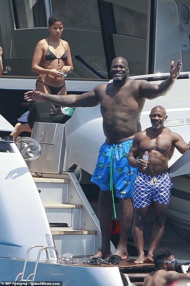 Looking great: The star looked happy as he chatted with friends on the yacht