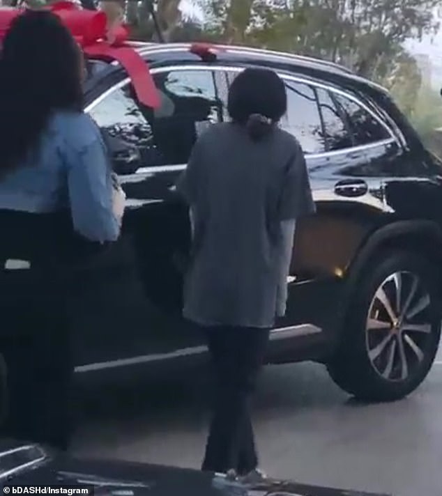 Fantastic: The automobile was all decked out for the occasion with red bows stuck onto it in order to give it a festive air