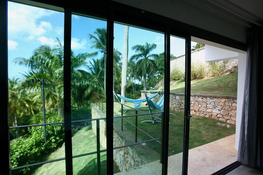 The terraced yard is visible from floor-to-ceiling windows.