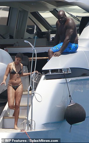 Chatting: The couple looked in great spirits as they chatted on the yacht