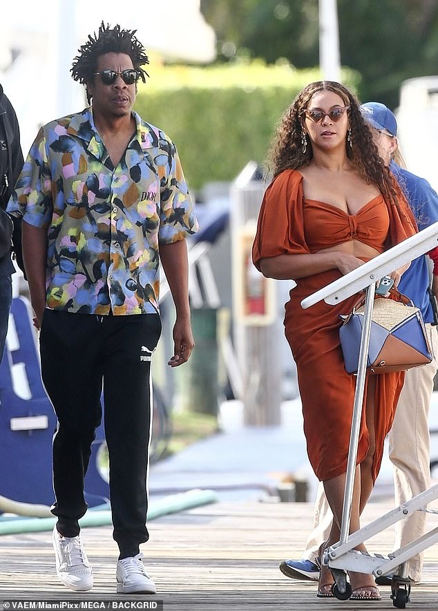 Chilled out: Beyonce looked lovely in a  burnt orange top and matching skirt while walking alongside her husband at a dock in Fort Lauderdale, Florida, on Monday