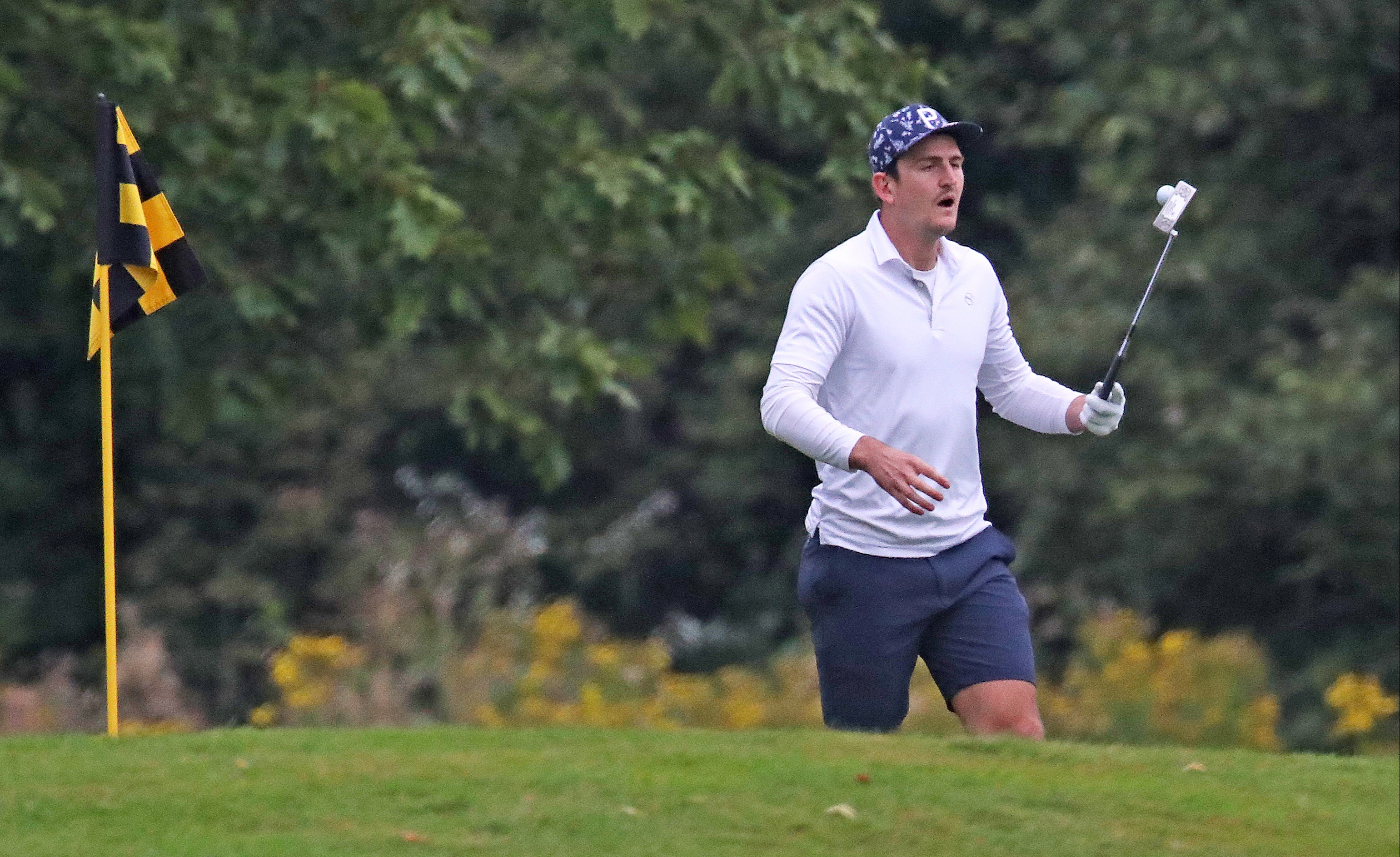 At one stage Maguire looked on as he watched to see if his putt was successful